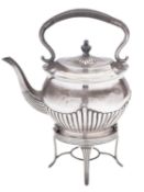 An Edwardian silver kettle on stand, oval form, with a part-fluted body, cover & spout,