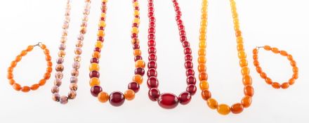 A mixed group of jewellery, including a graduated oval bead cherry 'amber type' necklace,