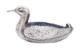 An Edwardian novelty silver pin cushion, in the form of a seated duck,