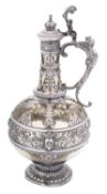 An early 20th century continental silver plated Theresienthal style glass wine ewer,