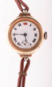 Cyma a 9K gold lady's wristwatch the round white dial having black Arabic numerals and red Xii