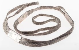 An item of interest, part of a lady's top half of dress attire (bra),