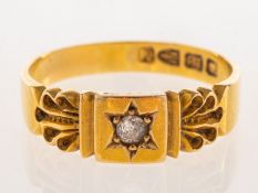 A Victorian 18ct gold diamond ring, star and grain set to the centre with an old-cut diamond,
