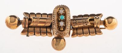 An ornate Victorian bar and ball brooch,