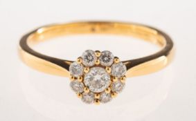 An 18ct gold diamond cluster ring, the flowerhead claw set with brilliant-cut diamonds,