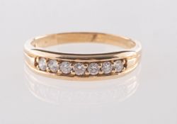 A 9ct gold diamond half eternity ring, grain set with seven brilliant-cut diamonds, diamonds approx.