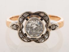 An Art Deco diamond ring, a bi-metal openwork flower design ring,