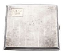 An early 20th century silver cigarette case, rectangular form, with applied gold initials,