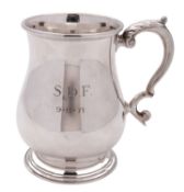 An Elizabeth II silver baluster mug, with a leaf-capped 