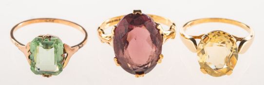 A group of three cocktail rings, including a 9ct gold ring,
