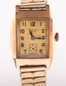 JW Benson, a 9K gold wristwatch the rectangular silvered dial having black Arabic numerals,