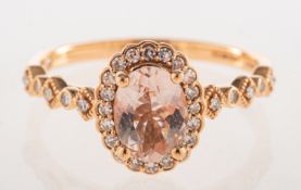 An 18ct rose gold morganite and diamond cluster ring,