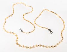 A freshwater pearl necklace, a string of knotted graduated freshwater pearls, pearls approx. 2.