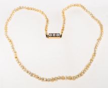 A freshwater pearl necklace, the freshwater pearls of organic slightly oval shape,