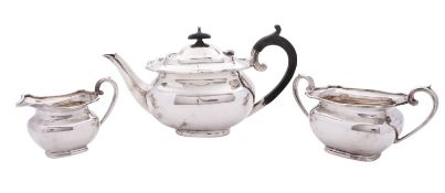 A George V three-piece silver tea set, shaped rectangular form,