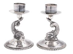 A pair of 20th century silver candlesticks, with beaded borders,