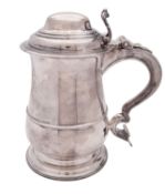 A George II silver tankard, baluster form, the domed cover with a chair-back thumbpiece,
