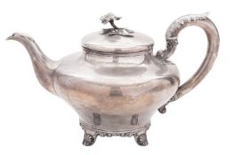 A Victorian North-Country provincial silver tea pot, circular form, with a bellied body,