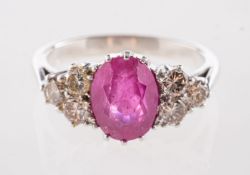 A ruby and diamond ring, claw set to the centre with an oval-cut ruby, ruby approx. 1.