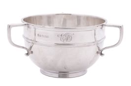 A George V silver three-handled bowl, circular form,