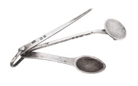 A George V silver pipe tamper, with three suspended implements, makers mark unclear,