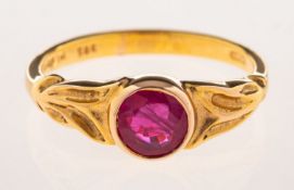 A 14ct gold ruby ring, collet set with a circular-cut ruby, measuring approx. 5.5mm x 2.