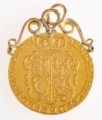 A George III spade guinea coin pendant, a 1782 George III spade guinea coin,