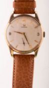 Omega a gentleman's 9k gold wristwatch the round cream dial having baton and Arabic numerals,
