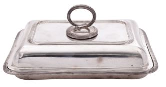 A George V silver entreé dish & cover, shaped rectangular outline,