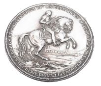 A modern silver plaque, circular outline and decorated in high relief with William IV on horseback,