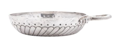 An 18th century French silver wine taster, circular form, with a snake ring handle,