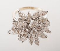 An impressive diamond cocktail ring, in the form of a flower spray,