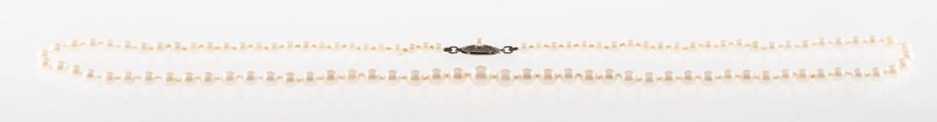 Mikimoto. A cultured pearl necklace, a string of graduated knotted cultured pearls, pearls approx.