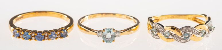 A group of three 9ct gold gem-set rings, including a 9ct gold ring,