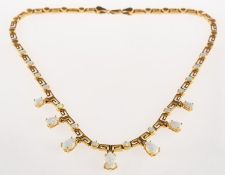An opal necklace, the articulated necklace predominantly of 'Greek Key' design links,