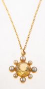 A citrine and pearl pendant with chain,