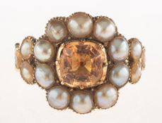 A Georgian topaz and pearl ring, claw and collet set to the centre with a square-cut topaz,