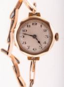 Enila, a 9K gold lady's wristwatch,