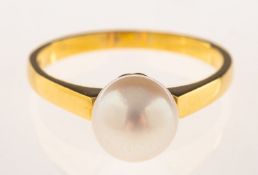 A single pearl ring, set with a single cultured pearl, marked 18ct & 750, size N, 3.