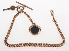 A watch chain with fob, a watch chain of graduated curb links with T-bar and swivel clasp,