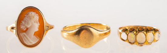 A group of three rings, including an 18ct gold signet ring, UK hallmark, size T1/2, 4.