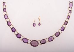 An antique amethyst, paste stone and seed pearl riviere necklace, (possibly Victorian),