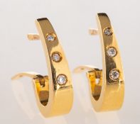 A pair of 18ct gold and diamond huggie earrings,