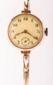 A 1930s 9K lady's wristwatch the round enamel dial having black Arabic numerals,