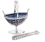 A late 19th/ early 20th century continental silver swing-handled sugar basket & matching sugar