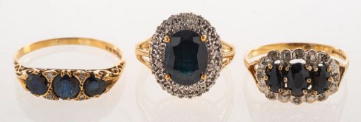 A group of three 9ct gold sapphire and diamond rings,
