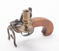 An Italian reproduction flintlock tinder pistol, with brass action, sconce and stand,