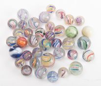A collection of late19th/early 20th century glass marbles , with 'birdcage' coloured glass twists,
