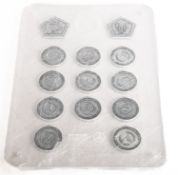 A set of 2018 Mercedes Formula One World Champions' medals.