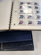 A GB collection of stamps in four hingless albums.